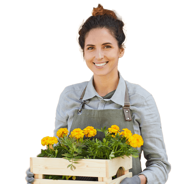 A cropped photo of a smiling woman hold a wooden box typed flower pot.